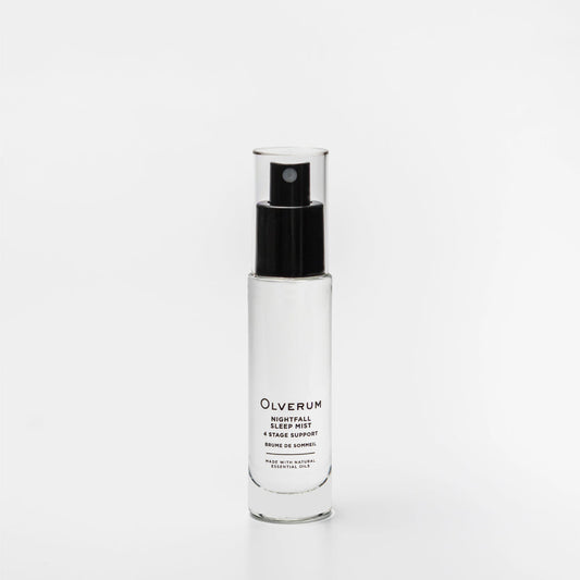 Clear spray bottle with black cap labeled 'Olverum' on a white background