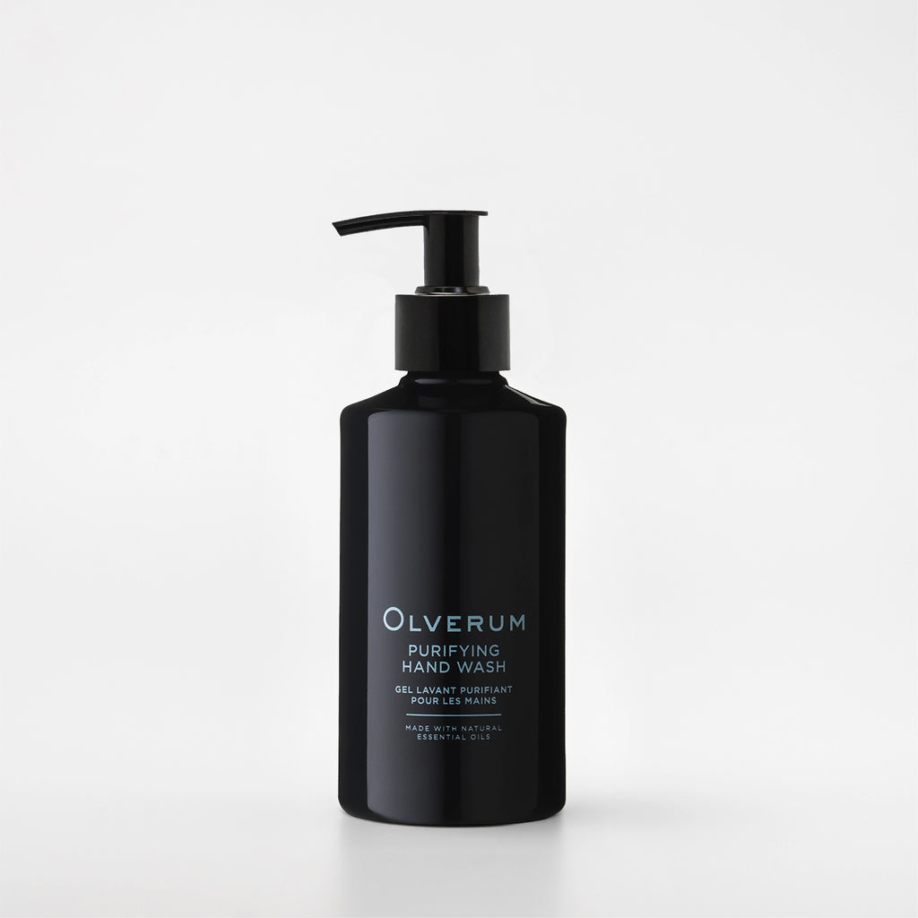 Black bottle of Olverum hand wash on a white background
