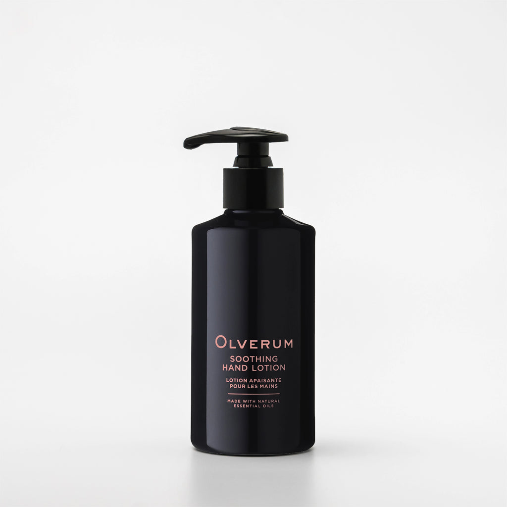 Black bottle of Olverum soothing hand lotion on a white background