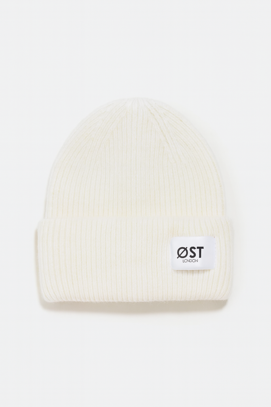 White beanie with a logo on a white background