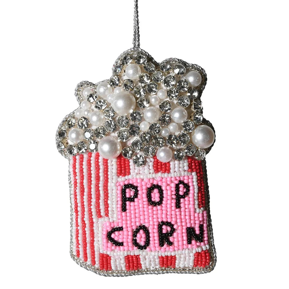 Decorative ornament shaped like a popcorn bucket with beads and pearls on a white background