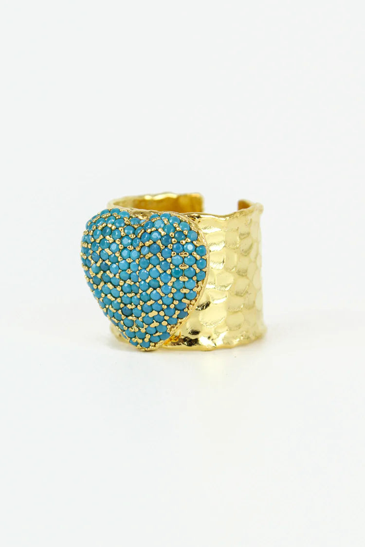 gold ring with pretty turquoise stones that create a heart