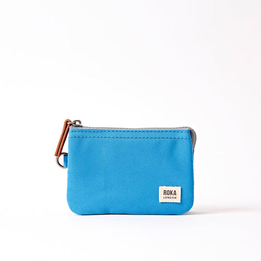 Blue pouch with a visible brand label on a white background