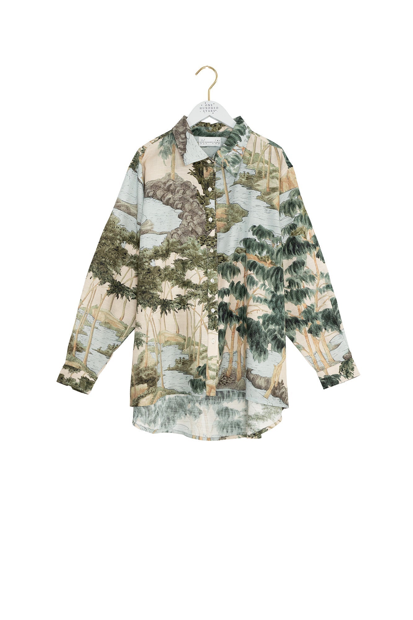 Floral patterned shirt on a hanger against a white background