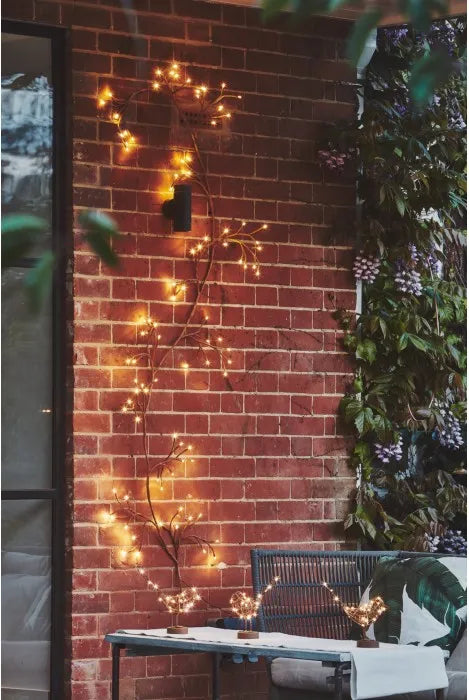 Lightstyle London Solar Ivy in Brown  displayed on an exterior wall