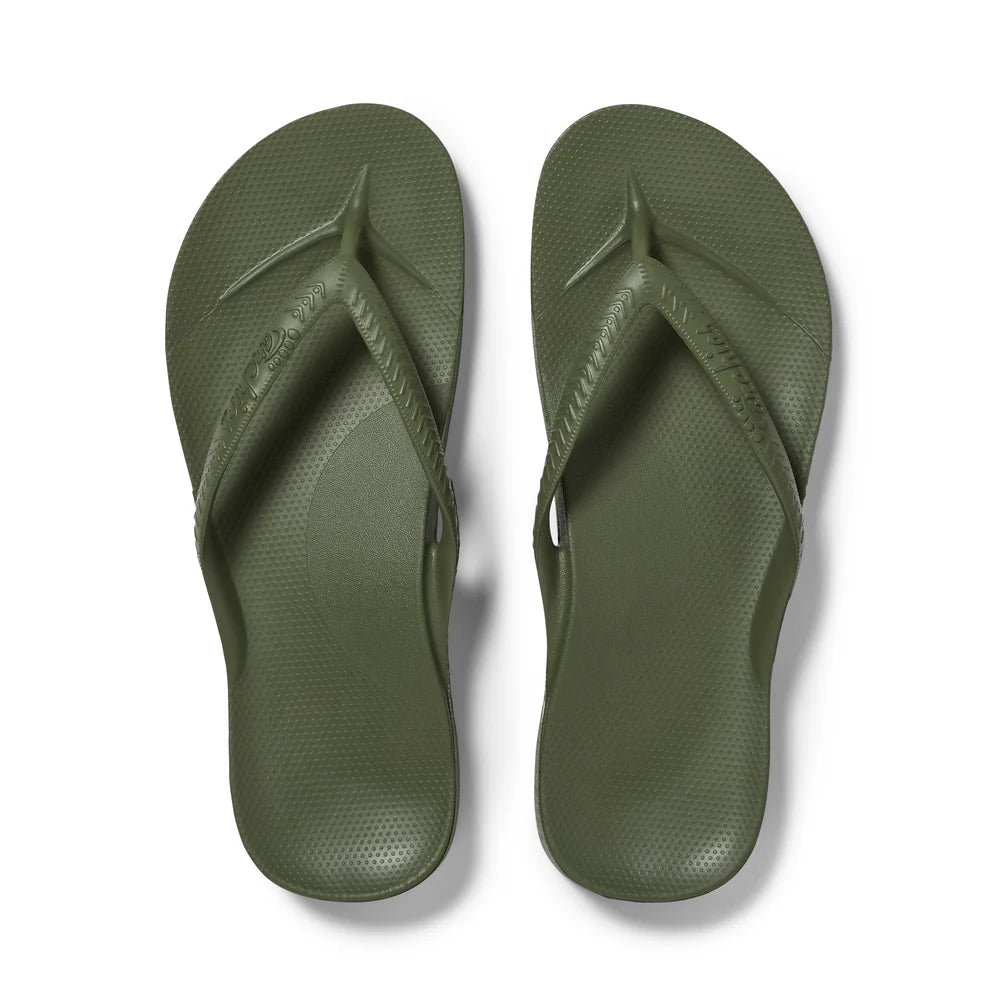 Pair of khaki flip-flops on a white background