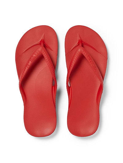 A pair of red flip-flops shown from a top-down view on a clean white background.