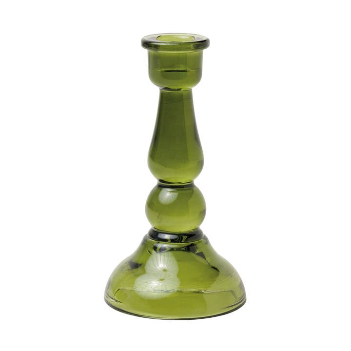 Green glass candle holder on a white background