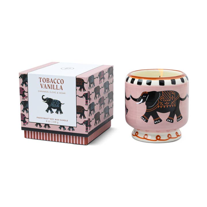 Candle with elephant design and packaging on a white background