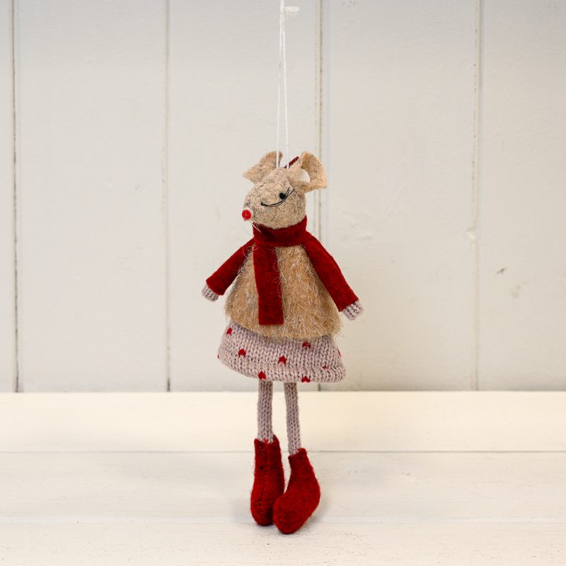 Stuffed animal toy resembling a mouse with a red scarf, dress, and boots on a white background
