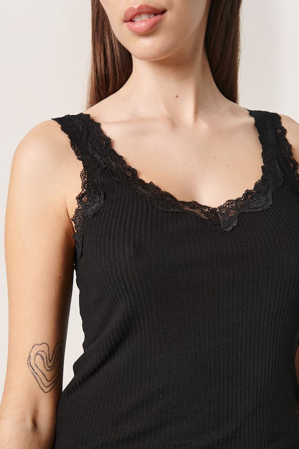 This image features the Soaked in Luxury Leandra Singlet, a stylish and sophisticated black sleeveless top. The singlet has a deep V-neckline and is adorned with intricate lace detailing along the neckline and edges, adding a touch of elegance.