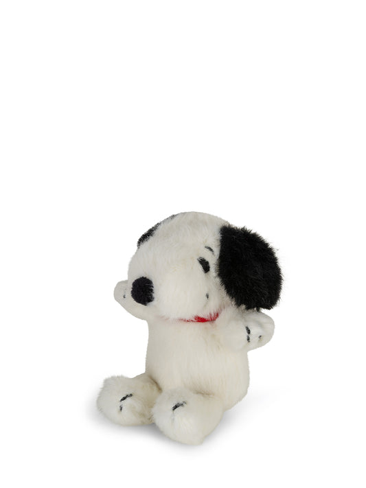 A small plush Snoopy dog toy sitting upright on a plain white background.