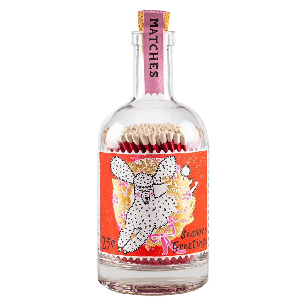 Bottle of matches with a colorful label featuring a dog design on a white background