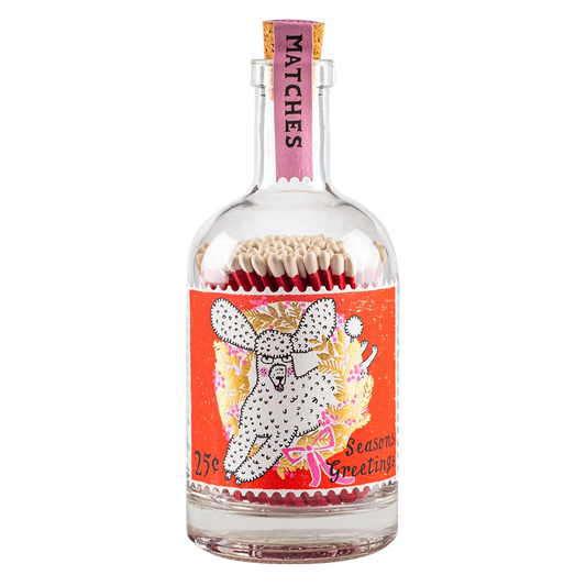 Bottle of matches with a colorful label featuring a dog design on a white background