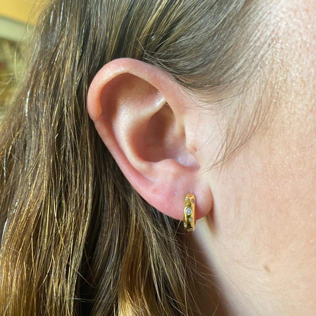 Reeves & Reeves Gold Plated Honor Hoop Earrings feature dazzling cubic zirconia stones