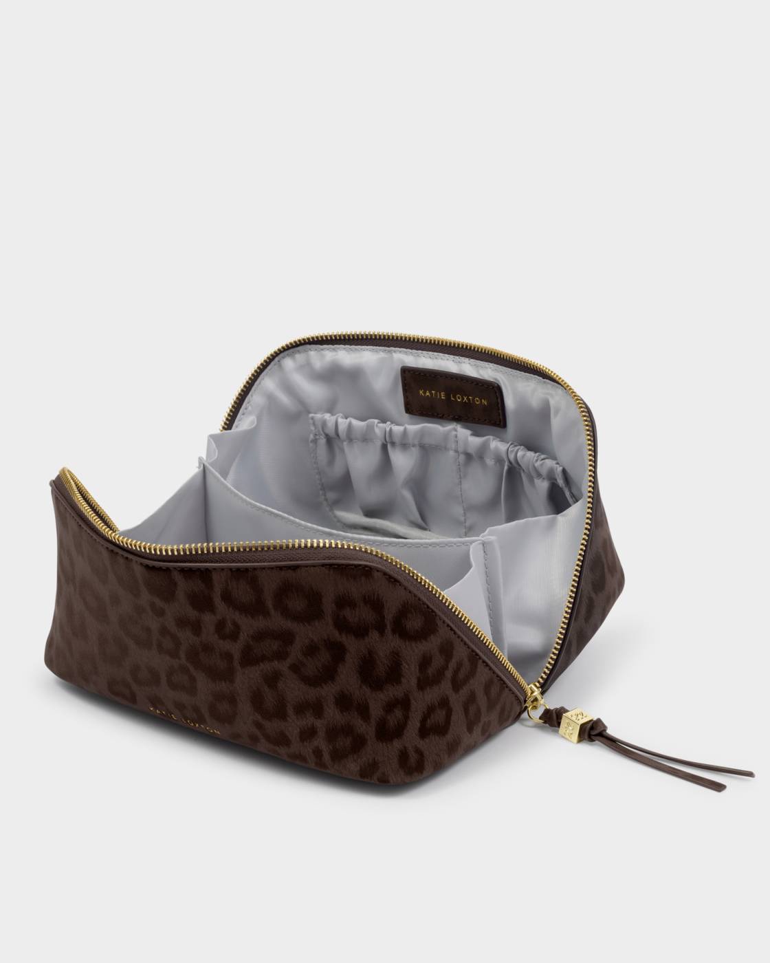Leopard print makeup bag with gold zipper on a light gray background