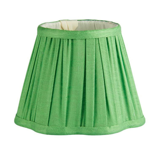 Green pleated lampshade on a white background