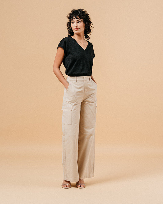 Grace & Malin Black Metallic Tee with beige cargo pants and strappy sandals