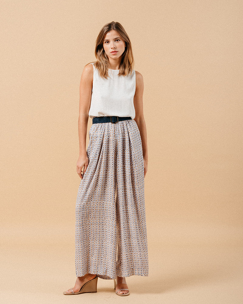 Grace & Mila Masha trousers in blue with white sleeveless top and black belt