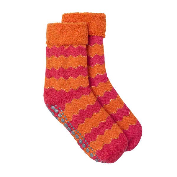 A pair of orange and pink striped slipper socks with a loop-back design and anti-slip rubber dot soles.